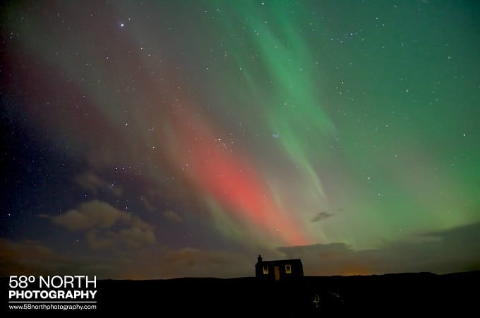 Old house illuminated by the Norther Lights, Isle of Lewis