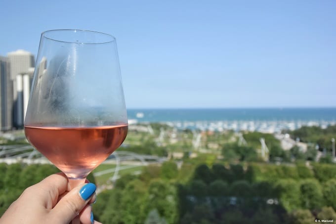 A glass of wine and a view of Lake Michigan