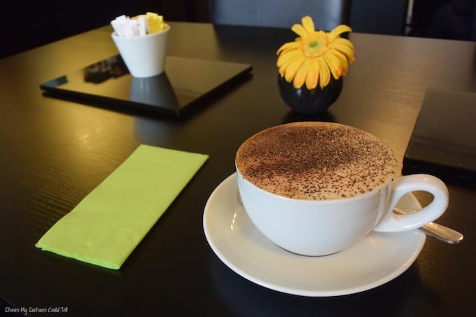 Coffee and flowers on table